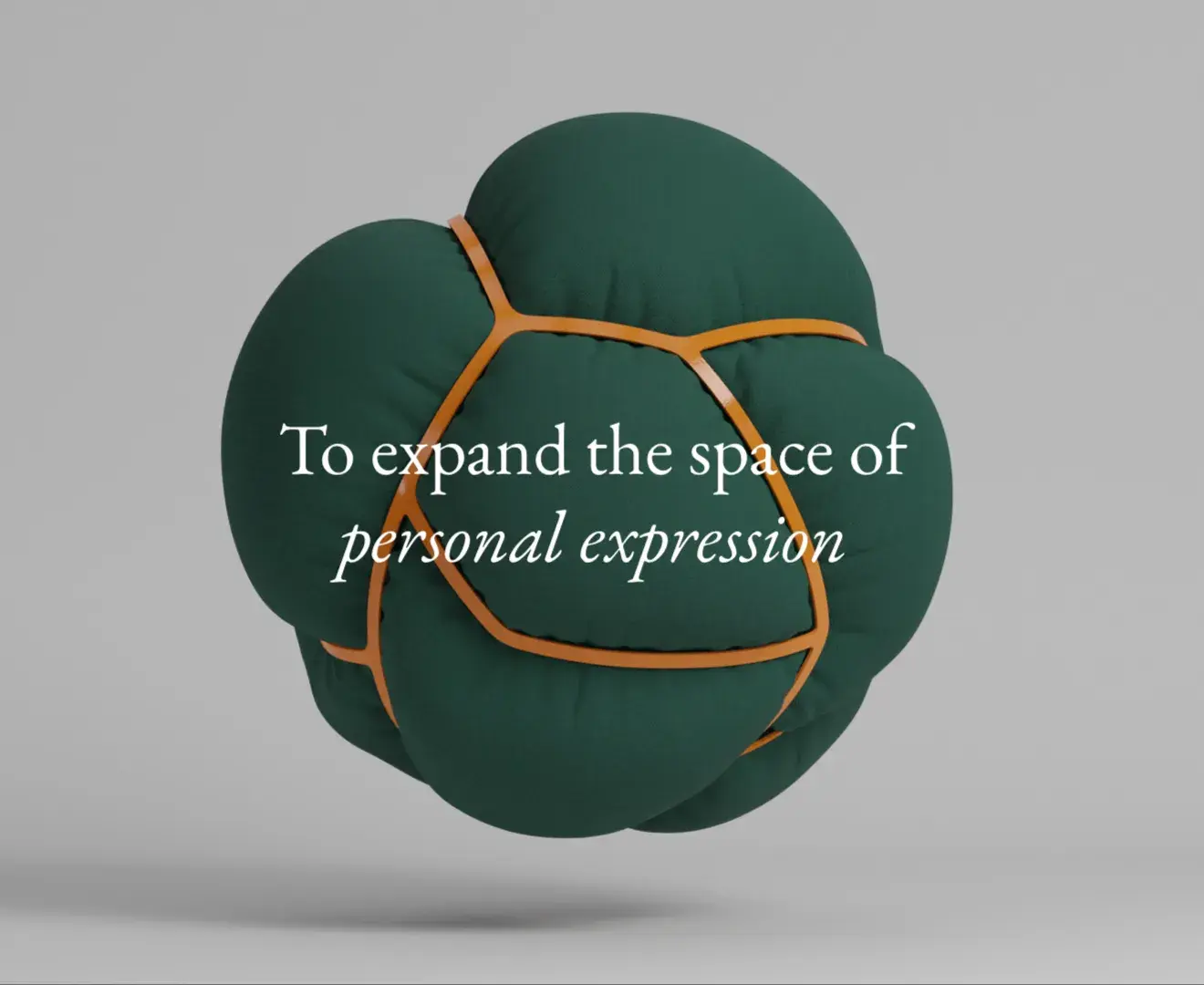 A green, spherical cushion with orange seams floats against a gray background, featuring the text "To expand the space of personal expression."