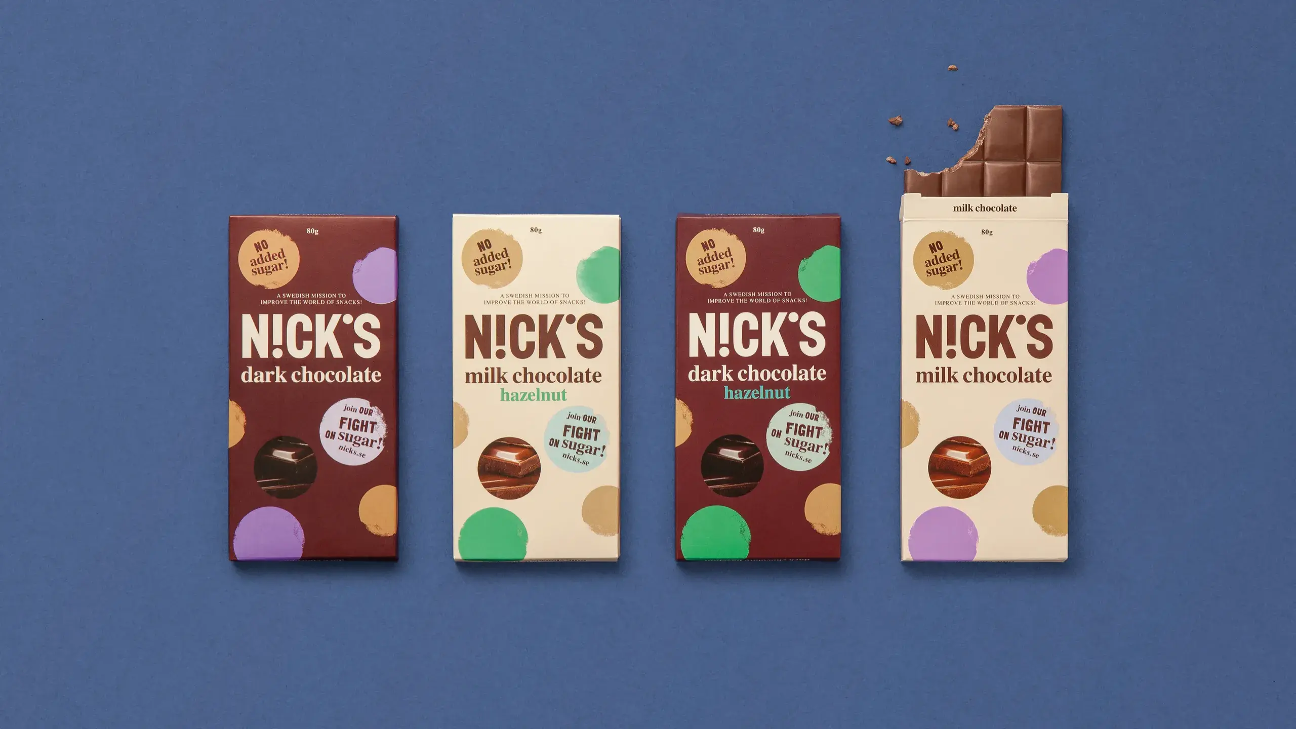 Four Nick's chocolate bars on a blue background, including dark and milk chocolate varieties, one partially eaten.