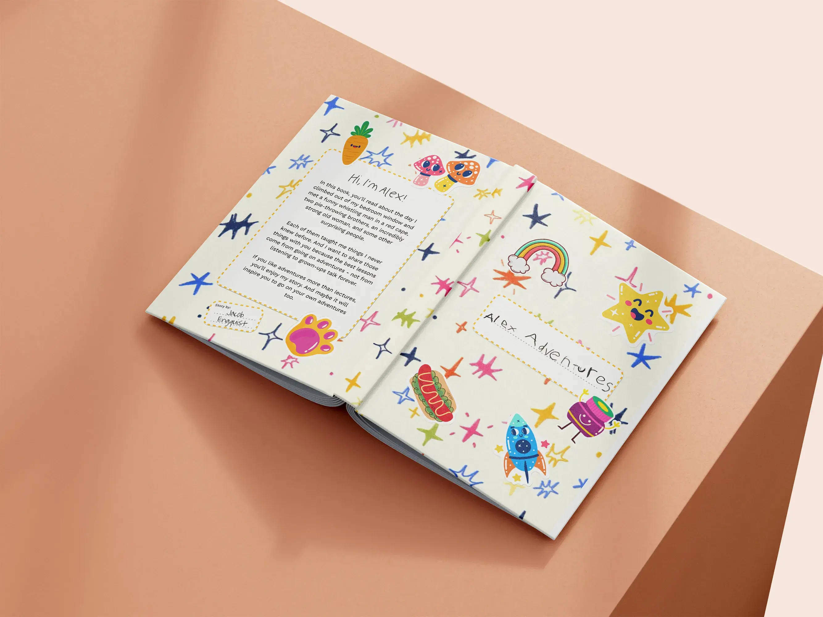 Open children's book on a peach-colored surface, featuring colorful illustrations of stars, a rainbow, and playful monsters.