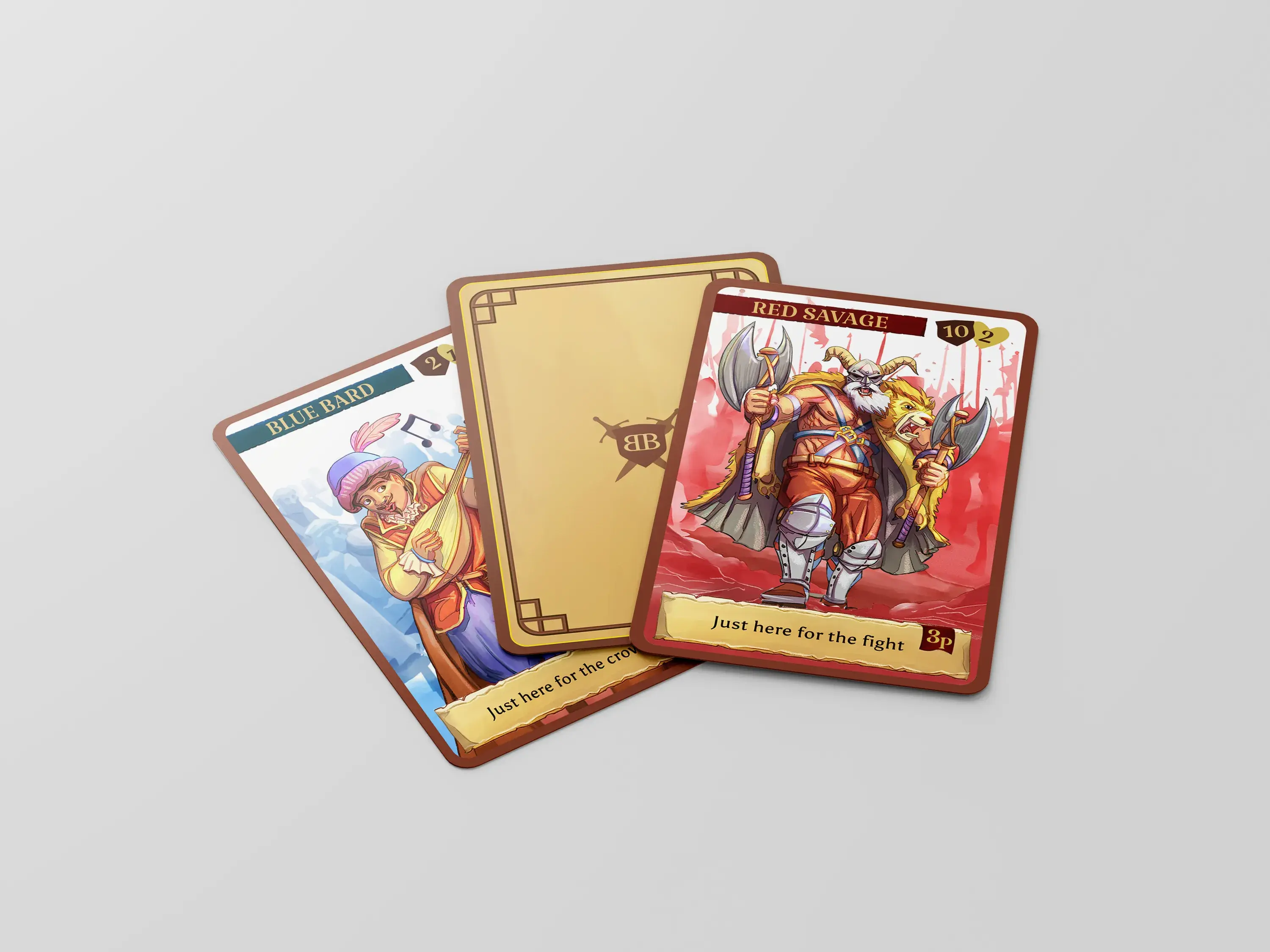 Three fantasy-themed game cards on a table: "Red Savage" with a warrior, "Blue Bard" with a musician, and a blank card with a logo.